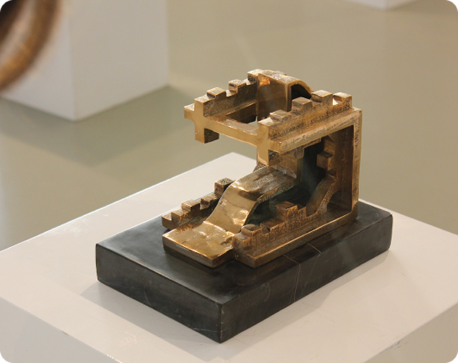 Inverted City on a plinth in a gallery