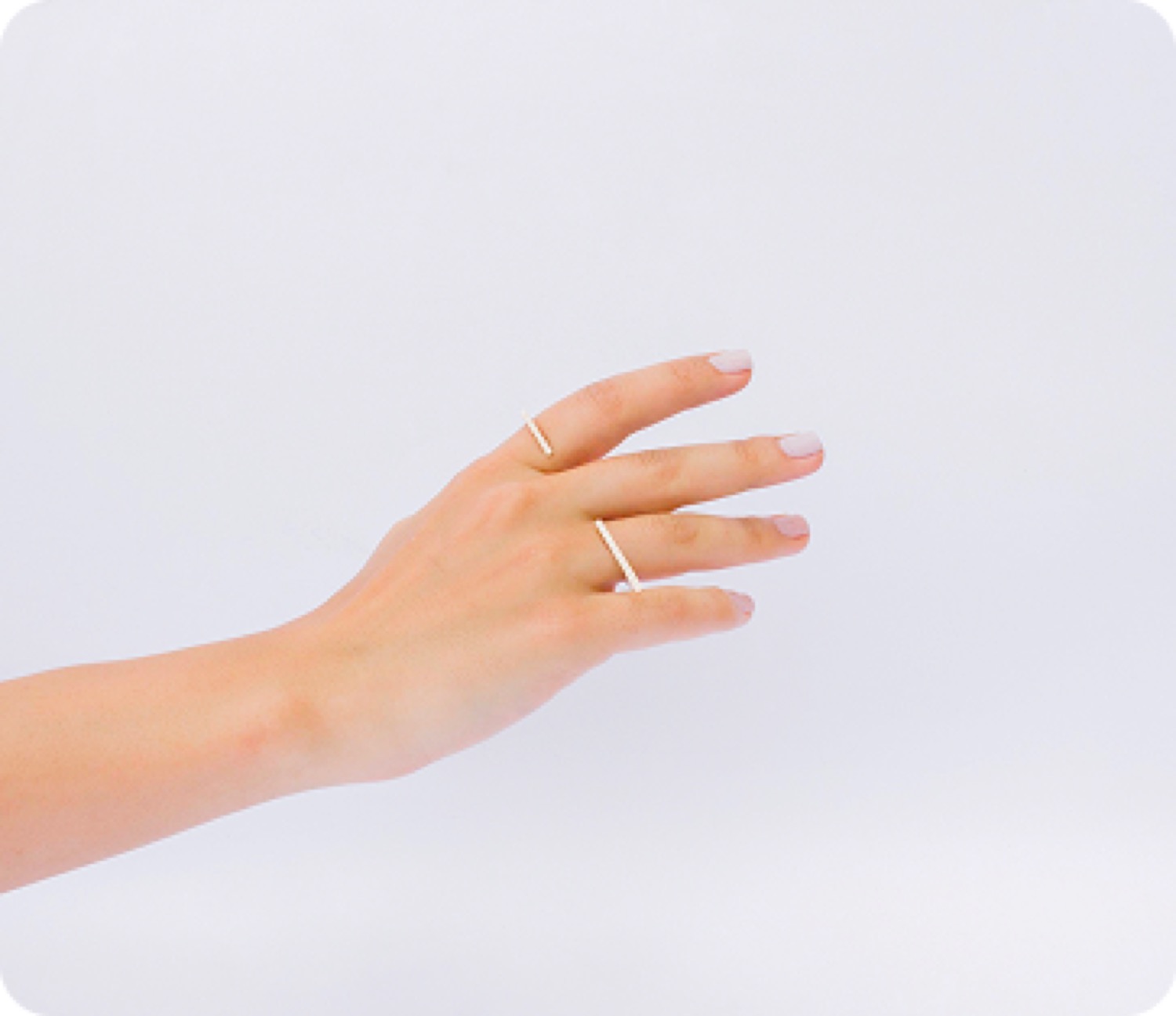 An outstretched arm and hand wearing a single ring