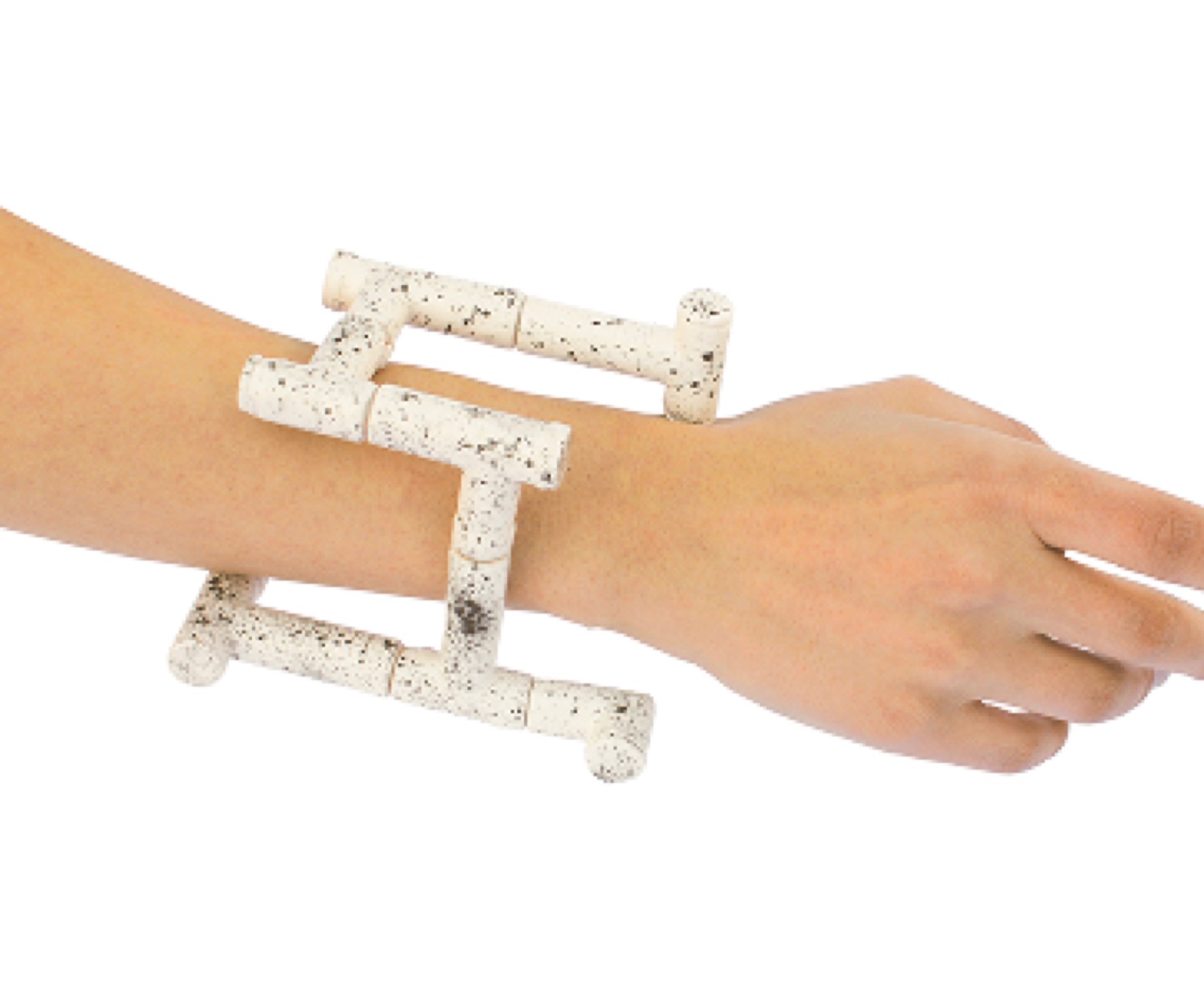 A speckled white cuff worn along the forearm