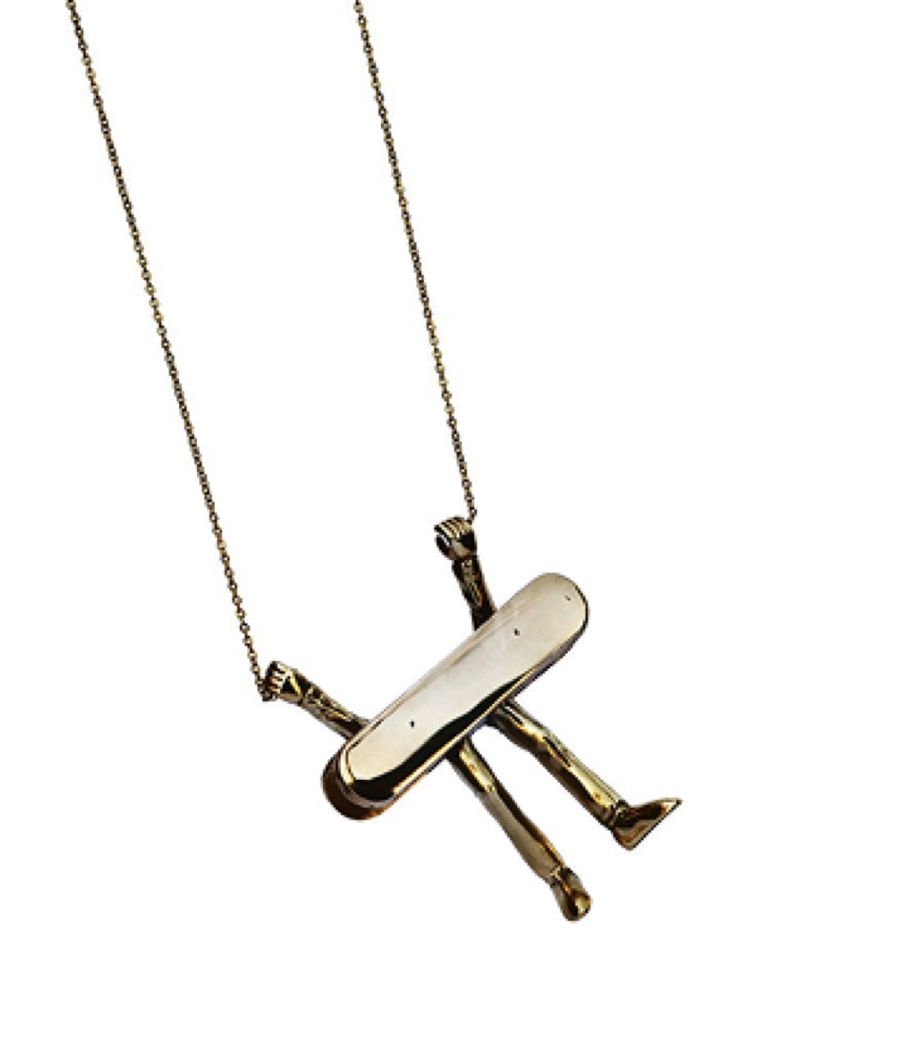 A gold figure pendant on a long chain, against white